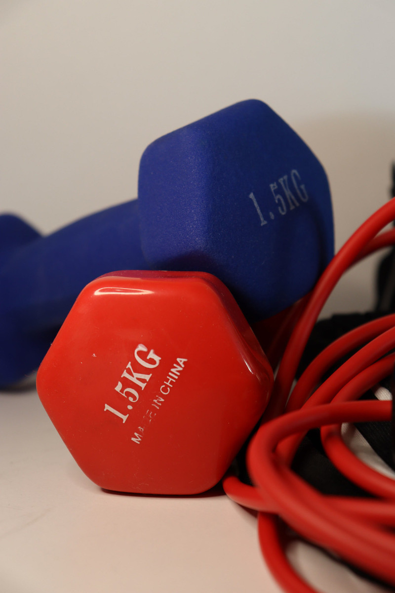 Red and blue vinyl dumbbells with red bands.