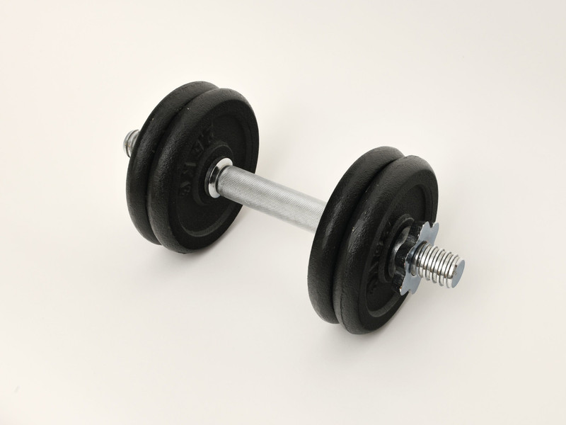 An adjustable plate dumbbell on white.