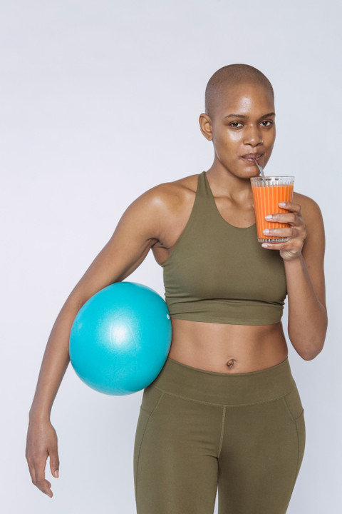 The olive set with a gym ball and a smoothie.